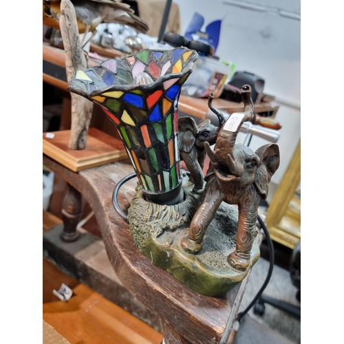 262 - A pretty resin elephant formed lamp with a stain glass shade by Widdop Bigham, signed to the rear 19... 