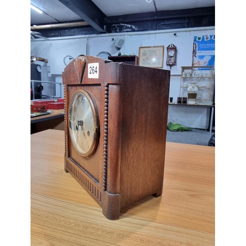 264 - A good quality solid oak cased art deco mantel clock in very clean condition with no nasty marks to ... 