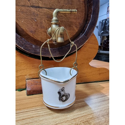 271 - A good quality vintage solid oak copper bound barrel keg on its original stand with a wooden stopper... 