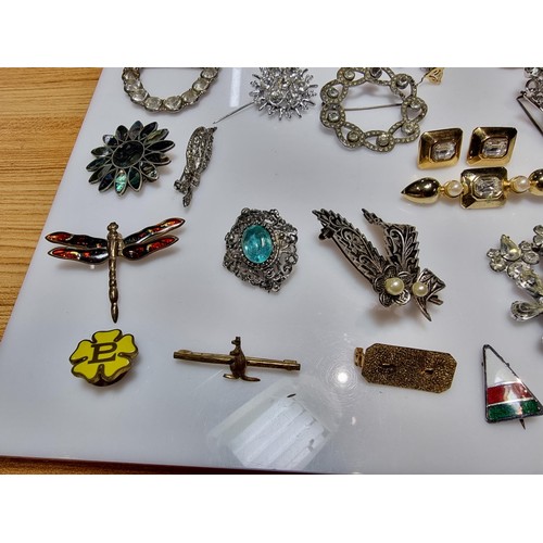 274 - A large collection of approx 50 various brooches, display board is not included, please study photos... 