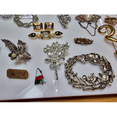 274 - A large collection of approx 50 various brooches, display board is not included, please study photos... 