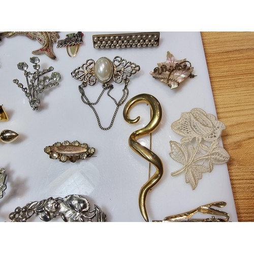 274 - A large collection of approx 50 various brooches, display board is not included, please study photos... 