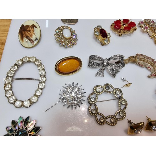 274 - A large collection of approx 50 various brooches, display board is not included, please study photos... 