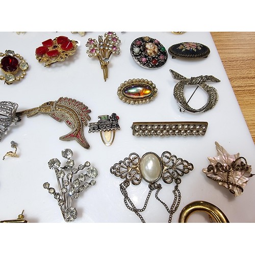 274 - A large collection of approx 50 various brooches, display board is not included, please study photos... 