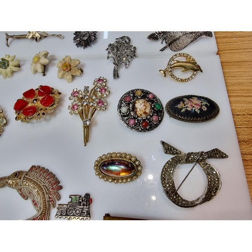 274 - A large collection of approx 50 various brooches, display board is not included, please study photos... 