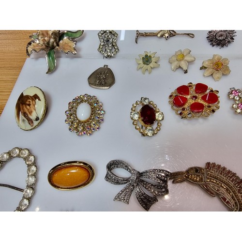 274 - A large collection of approx 50 various brooches, display board is not included, please study photos... 