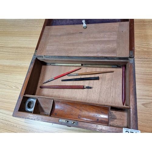 276 - an antique mahogany writing box fitted inside with a writing slope and many different compartments, ... 