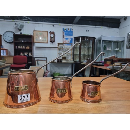 277 - 3 good antique copper graduated cider measures, largest pot has a height of 12cm, diameter 13cm.