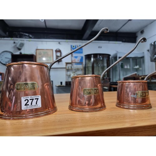 277 - 3 good antique copper graduated cider measures, largest pot has a height of 12cm, diameter 13cm.