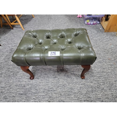 507 - Green leather buttoned footstool on cabriole legs leather in good order 
34cm by 55cm and 34cm high