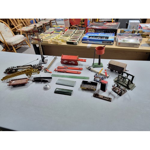 22 - A large collection of O Gauge Hornby railway items to include buffer stops, rolling stock, signal ar... 