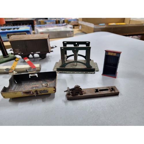 22 - A large collection of O Gauge Hornby railway items to include buffer stops, rolling stock, signal ar... 