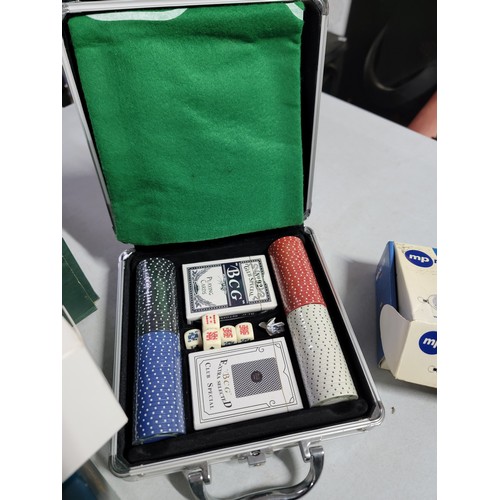 471A - Box containing a quantity of board games etc inc a cased poker set, chess set, boxed Tom Tom etc