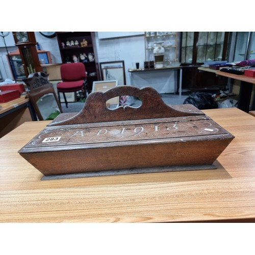 283 - A good solid oak Edwardian 2 compartment carrying box, carved to the top A.D 1913, has a height of 2... 