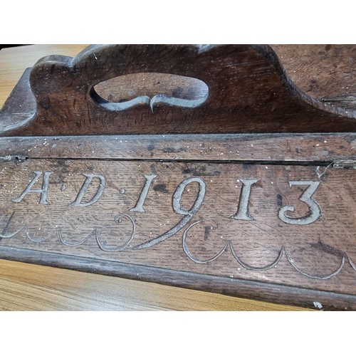 283 - A good solid oak Edwardian 2 compartment carrying box, carved to the top A.D 1913, has a height of 2... 