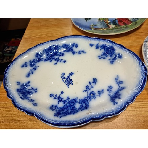 287 - A collection of antique plates to include a good hand painted charger made in Germany, an antique We... 