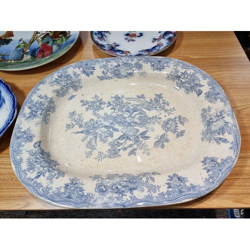 287 - A collection of antique plates to include a good hand painted charger made in Germany, an antique We... 