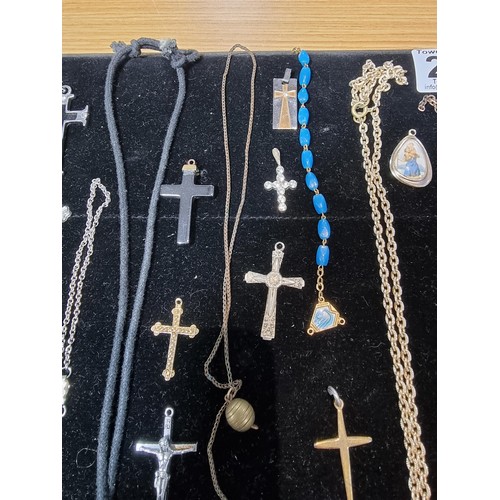 284 - A suite of various religious related jewellery to include many Crucifix's and crosses some with Rosa... 