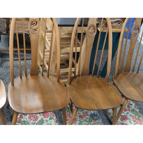 476 - Set of 4 Ercol spindle back dining chairs with carved swan in backs, with floral seat pads all in go... 