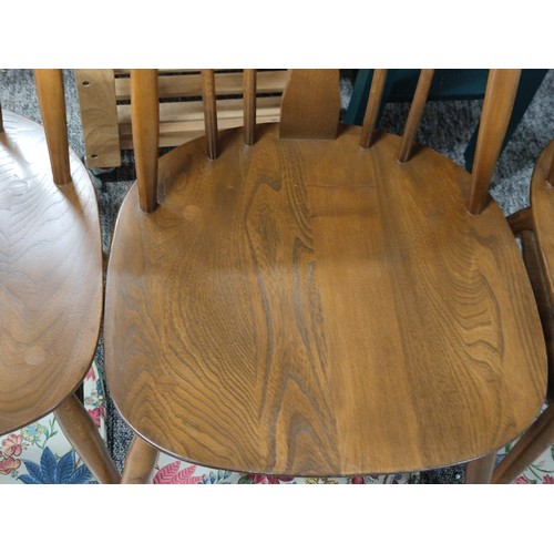 476 - Set of 4 Ercol spindle back dining chairs with carved swan in backs, with floral seat pads all in go... 