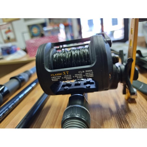 2 - A Vulcan X 12 ft 43/4LB sea fishing rod with a Okuma classic XT fishing reel along with a Salt XT 20... 