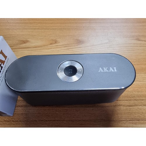 12 - An Akai DYNMX portable Bluetooth speaker with dual super bass speakers in its original box and in go... 