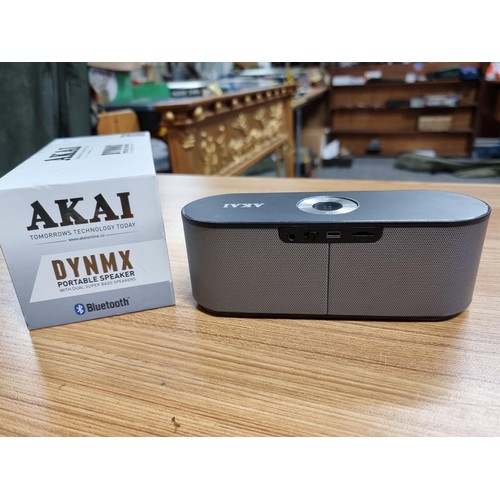 12 - An Akai DYNMX portable Bluetooth speaker with dual super bass speakers in its original box and in go... 