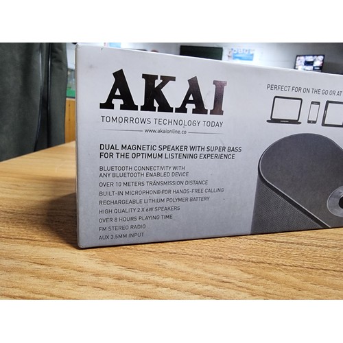 12 - An Akai DYNMX portable Bluetooth speaker with dual super bass speakers in its original box and in go... 