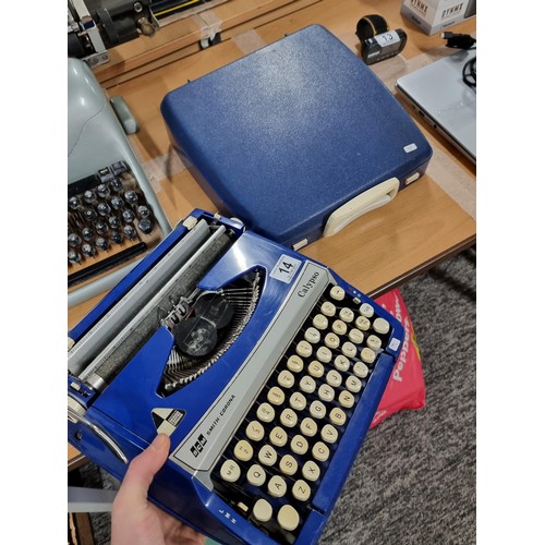 14 - A Smith Corona Calypso cased portable typewriter in good condition, keys appear to not stick.