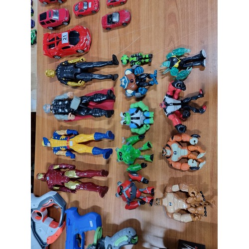 22 - A large collection of toys to include 14x various action figures, a WWE Tough Talkers wrestling ring... 