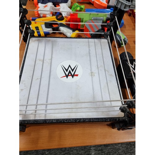 22 - A large collection of toys to include 14x various action figures, a WWE Tough Talkers wrestling ring... 