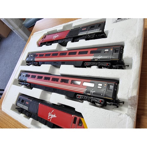 28 - A Hornby R2045 Virgin HST125 four cart set with loco and dummy and 2 coaches, works in directional l... 