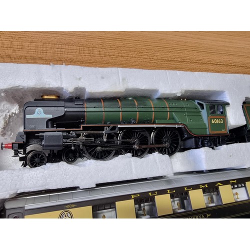 29 - A Hornby 3059 tornado and tender with a 3 pullman coaches 60163 the loco is missing its motor otherw... 