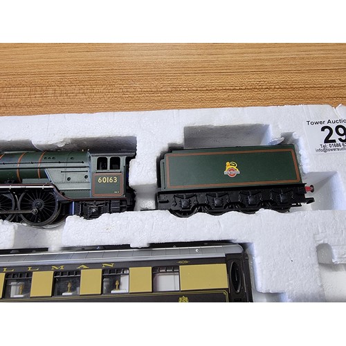 29 - A Hornby 3059 tornado and tender with a 3 pullman coaches 60163 the loco is missing its motor otherw... 