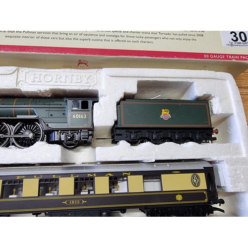 30 - An as new boxed Hornby R3093 tornado pullman track with tornado loco and tender with 3 matching pull... 