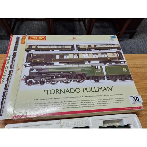 30 - An as new boxed Hornby R3093 tornado pullman track with tornado loco and tender with 3 matching pull... 