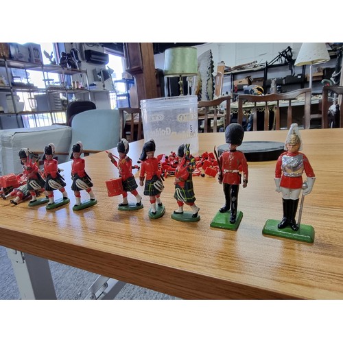 48 - A large collection in 2 tubs of toy soldier figures to include a collection of Britain's Queens guar... 