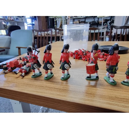 48 - A large collection in 2 tubs of toy soldier figures to include a collection of Britain's Queens guar... 