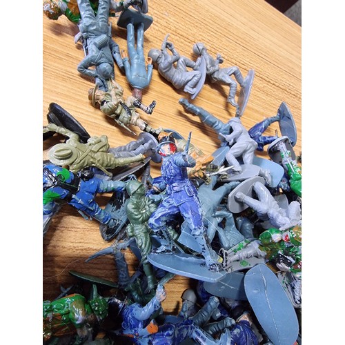 48 - A large collection in 2 tubs of toy soldier figures to include a collection of Britain's Queens guar... 