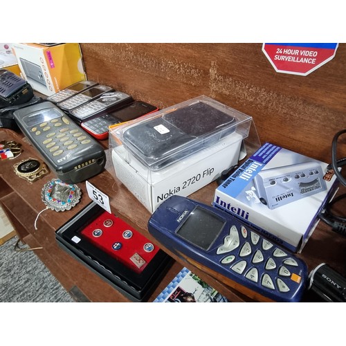 53 - A large collection of vintage mobile phones along with 2 portable CD players, 2x tom tom sat navs, a... 