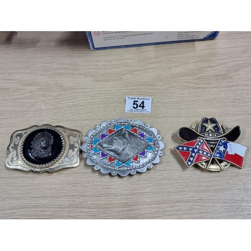 54 - 3 large metal collectable belt buckles to include a Navajo style buckle, a wolf buckle made out of s... 