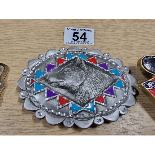 54 - 3 large metal collectable belt buckles to include a Navajo style buckle, a wolf buckle made out of s... 