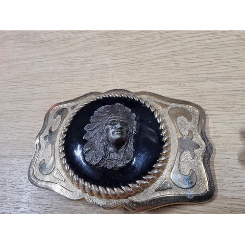 54 - 3 large metal collectable belt buckles to include a Navajo style buckle, a wolf buckle made out of s... 