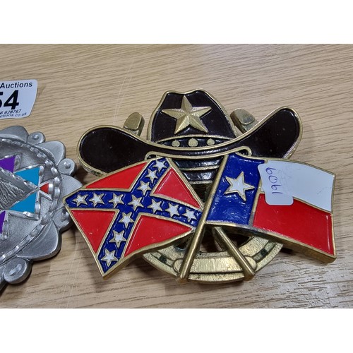 54 - 3 large metal collectable belt buckles to include a Navajo style buckle, a wolf buckle made out of s... 