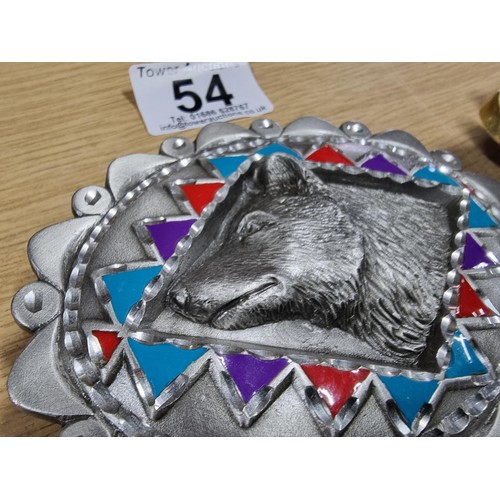 54 - 3 large metal collectable belt buckles to include a Navajo style buckle, a wolf buckle made out of s... 