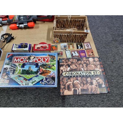 56 - A quantity of collectables to include 2 diecast cars, a Monopoly Worcester edition board game, Coron... 