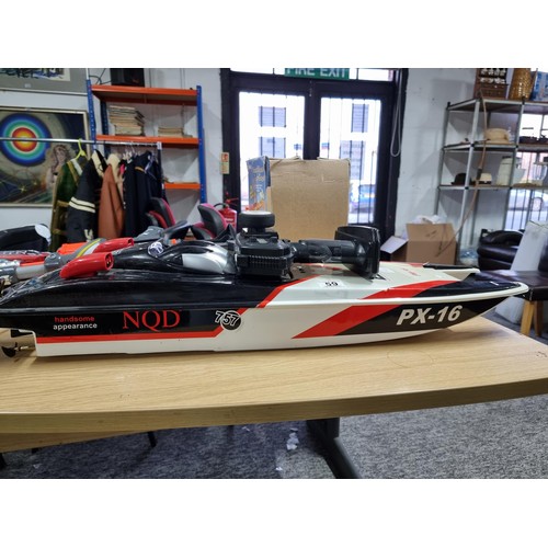 59 - A large plastic remote control boat, model NQD 757 PX-16, complete with its remote control and in go... 