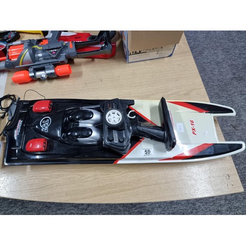 59 - A large plastic remote control boat, model NQD 757 PX-16, complete with its remote control and in go... 