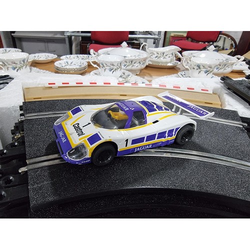 60 - A complete Scalextric Le Mans 24 hour set complete with its 2 cars and 1 extra car. In good clean co... 