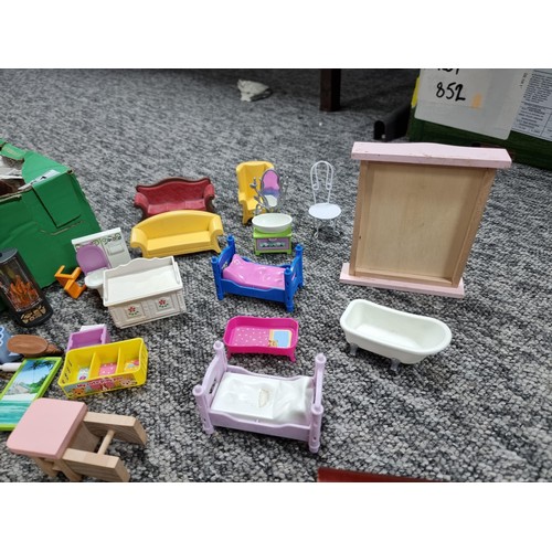 61 - A large collection of dolls house furniture mostly by Playmobil.